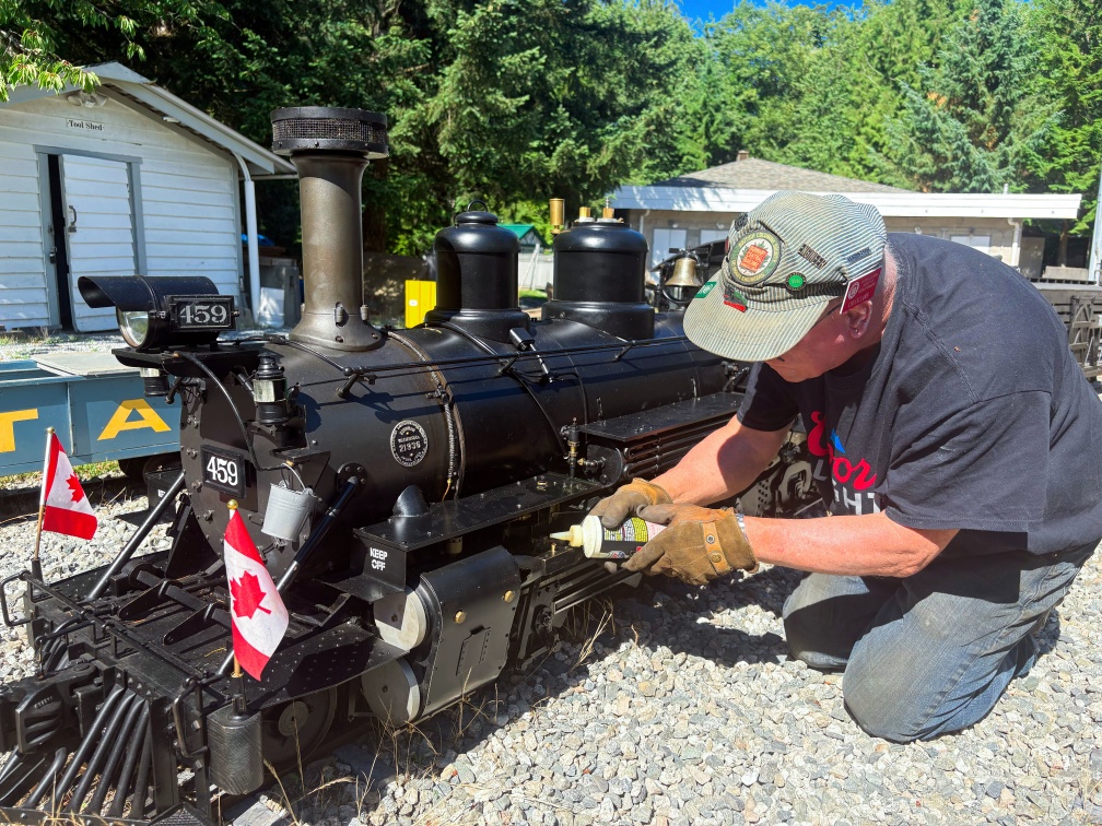 Engineer servicing locomotive between runs